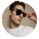 A men wearing stylish sunglasses from the Titan brand, showcasing a modern and fashionable design