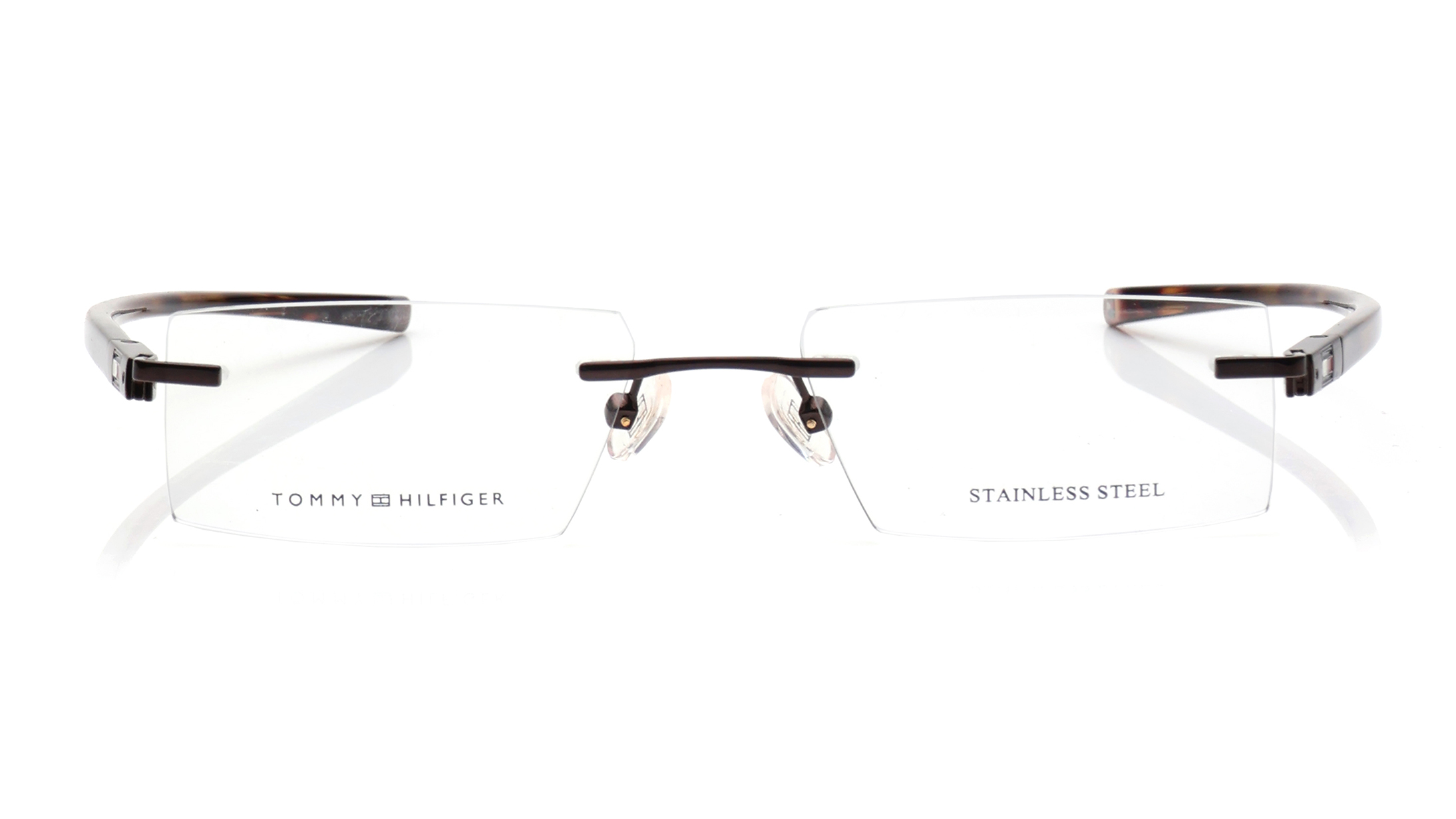Image 1 of Brown Rectangle Rimless Eyeglasses for Men and Women from Tommy Hilfiger Available at Titan Eye+