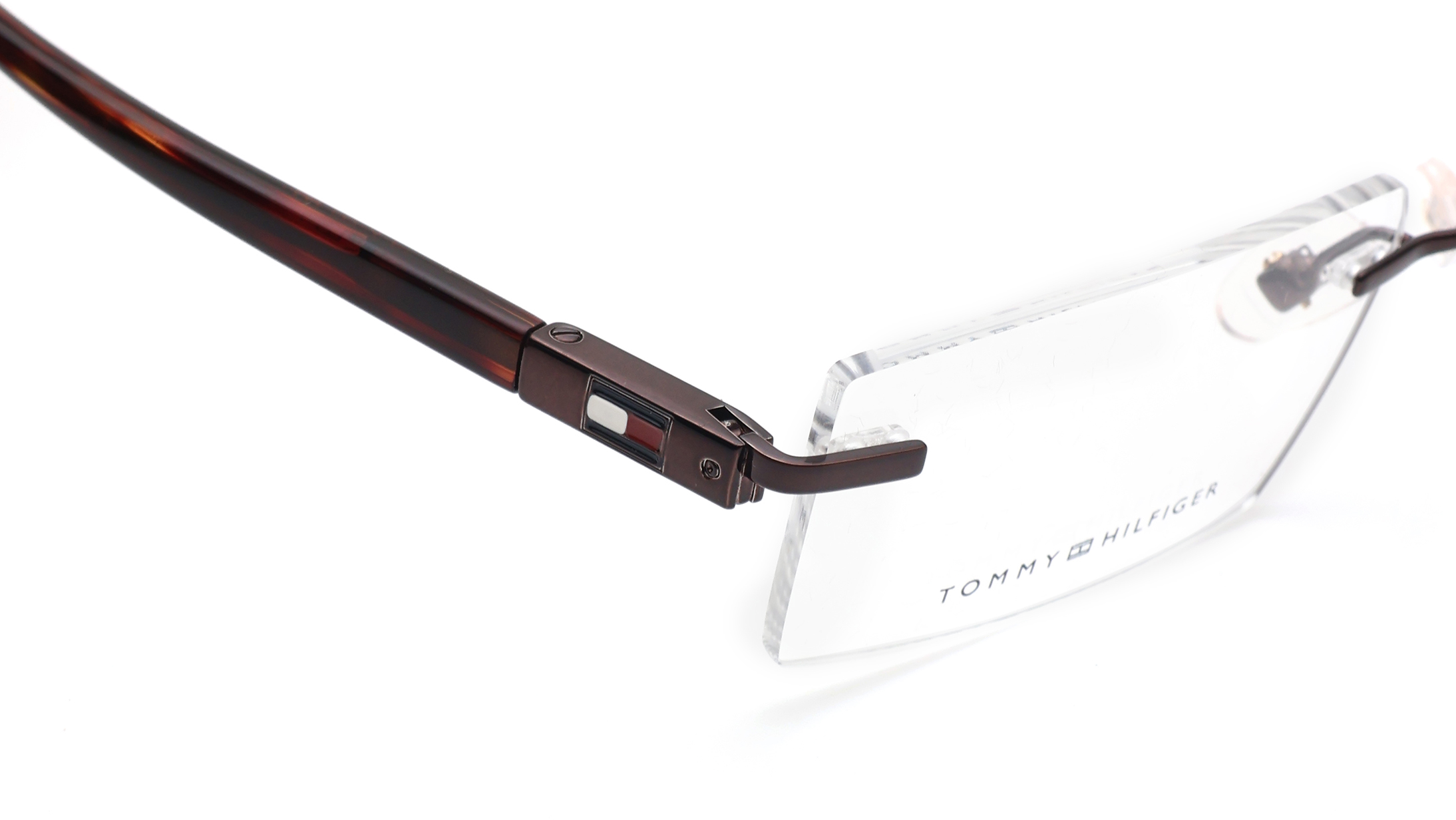 Image 5 of Brown Rectangle Rimless Eyeglasses for Men and Women from Tommy Hilfiger Available at Titan Eye+