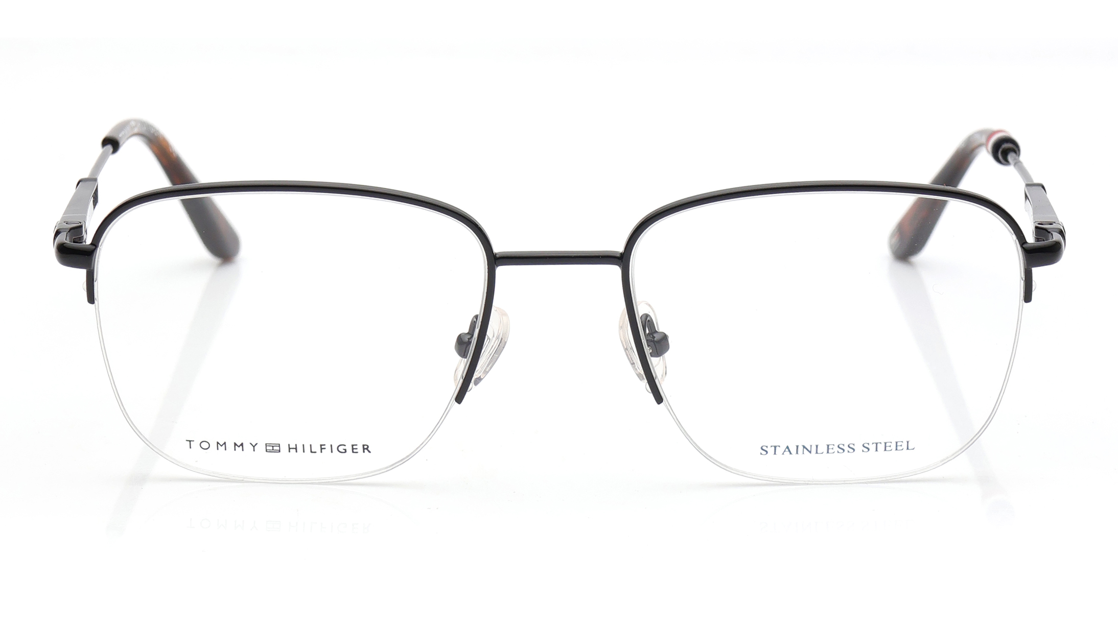 Image 1 of Black Oval Eyeglasses for Men and Women from Tommy Hilfiger Available at Titan Eye+
