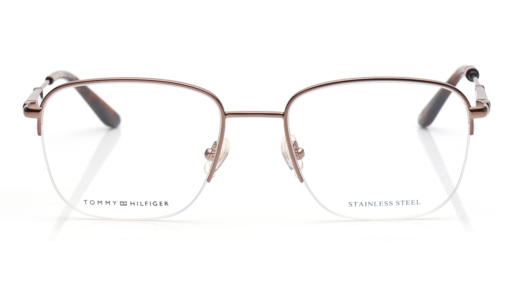 Image 1 of Brown Oval Eyeglasses for Men and Women from Tommy Hilfiger Available at Titan Eye+