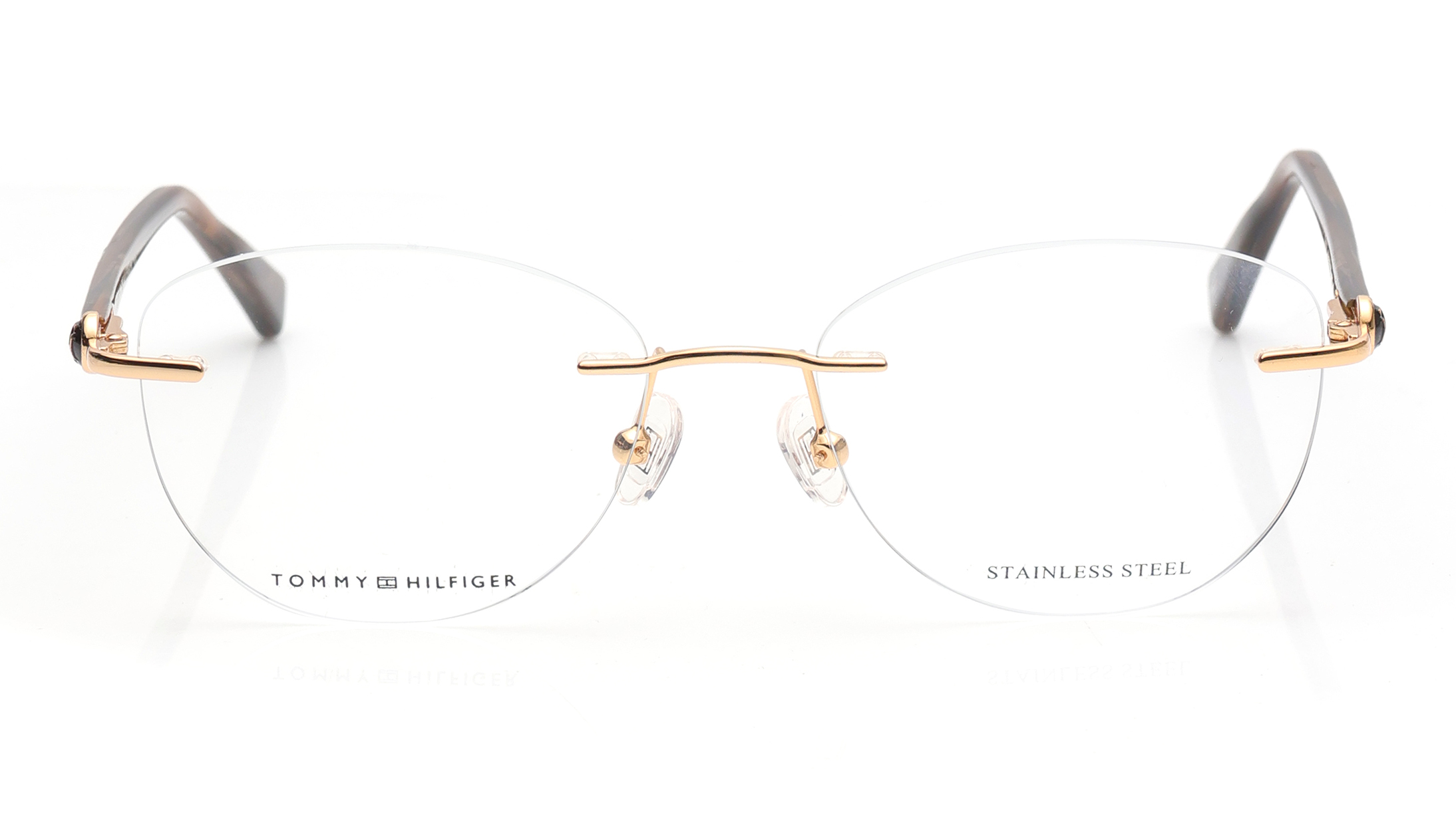 Image 1 of Gold Oval Eyeglasses for Women from Tommy Hilfiger Available at Titan Eye+