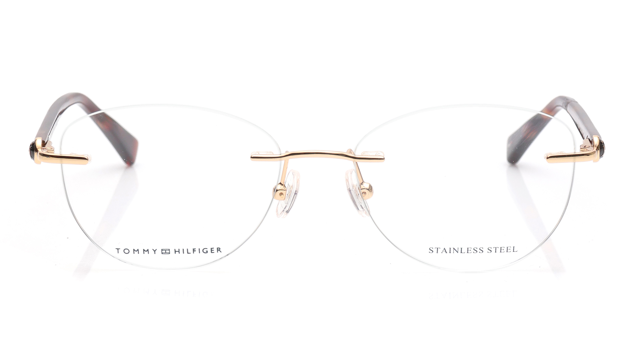 Image 1 of Gold Oval Eyeglasses for Women from Tommy Hilfiger Available at Titan Eye+