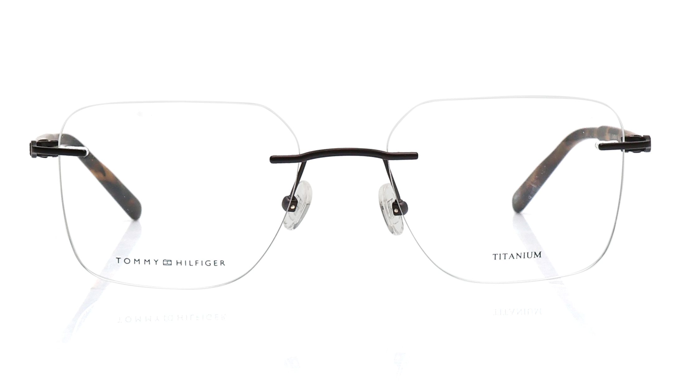 Image 1 of Brown Rectangle Rimless Eyeglasses for Men from Tommy Hilfiger Available at Titan Eye+